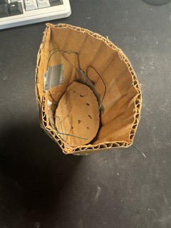 Early cardboard and wire prototype used to test pot geometry and drainage